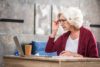 senior woman adjusting her eyeglasses