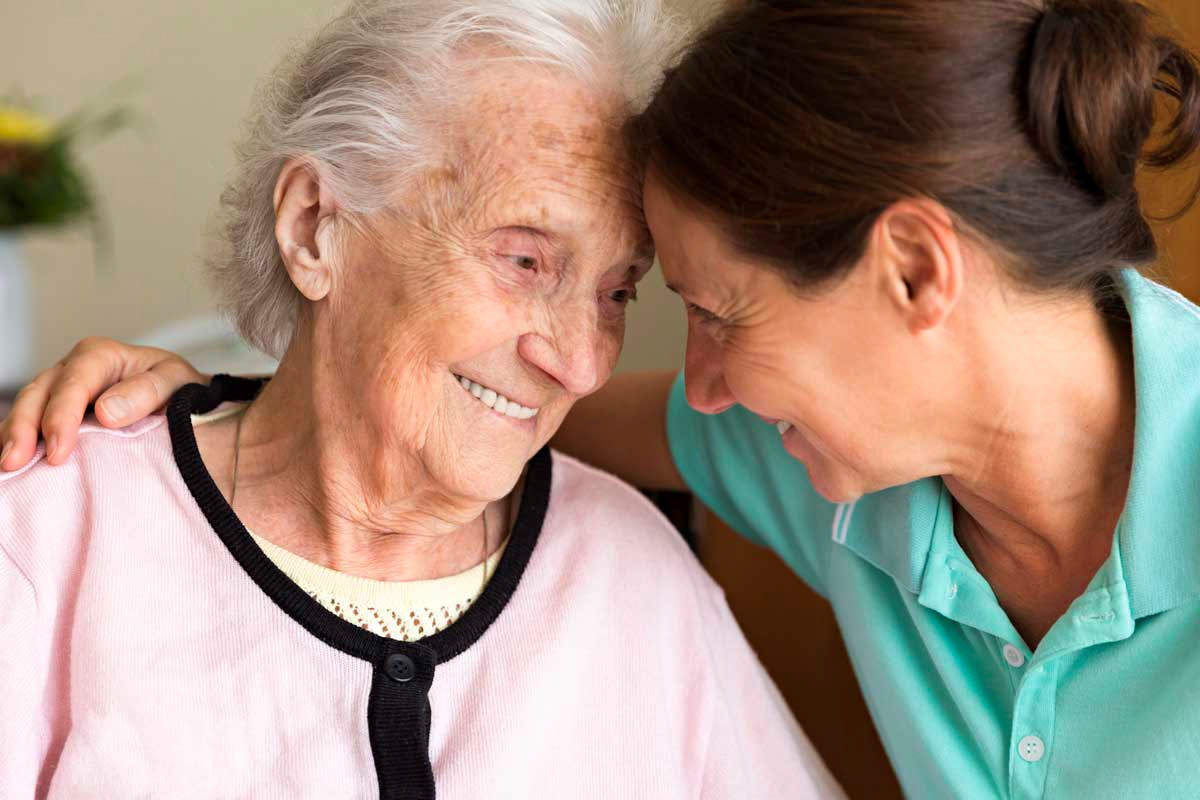 Caregiver with her patient bonding together - Ideas on How to Convince a Parent to Go to Assisted Living