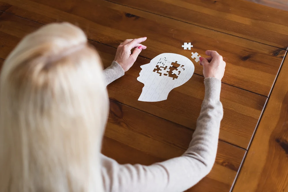 Person with dementia participating in a memory game, designed to boost their self-esteem and cognitive function while providing many health benefits
