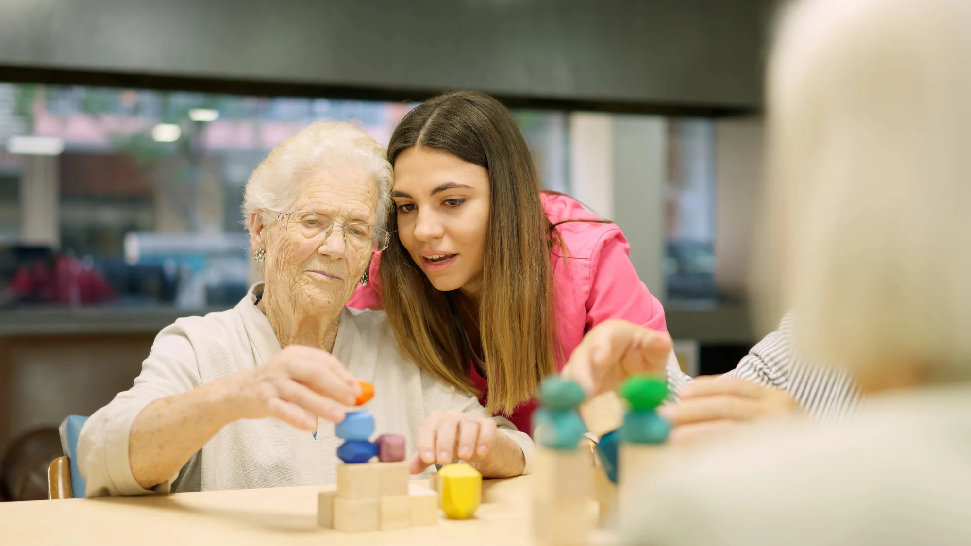 treatment plans for Alzheimer’s residents Health care providers consulting over personalized treatment plans for Alzheimer’s residents at Bel Air Assisted Living